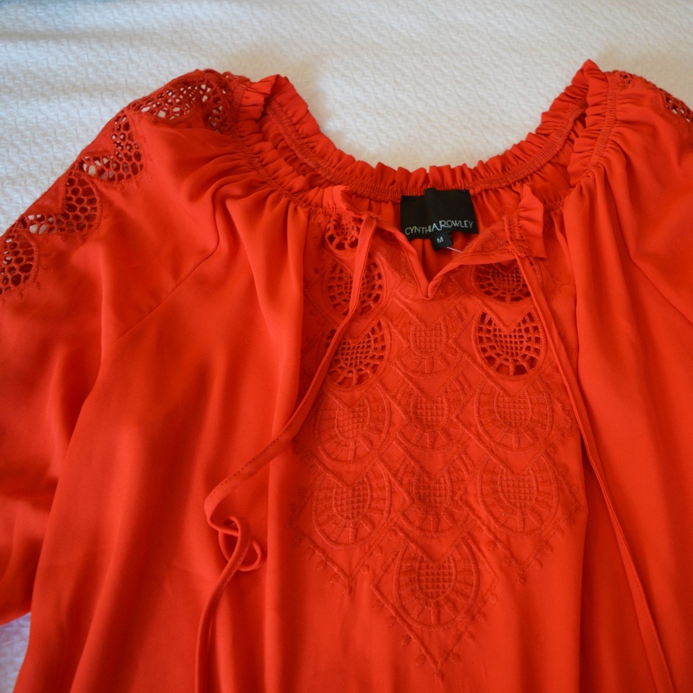 Orange crochet-style peasant blouse